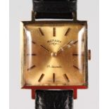 A GENTLEMAN'S GOLD ROTARY WRISTWATCH and leather strap.