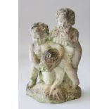 A COMPOSITION FOUNTAIN GROUP OF TWO CHERUBS AND A DOLPHIN. 1ft 10ins high.