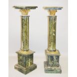 A PAIR OF GREEN MARBLE AND ORMOLU COLUMNS, 20TH CENTURY, with square tops, reeded supports on