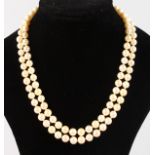 A GOLD PEARL NECKLACE and PAIR OF EAR CLIPS.