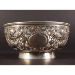 A CHINESE SILVER CIRCULAR BOWL, 6ins diameter, the sides pierced with dragons and lotus, complete