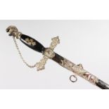 A MASONIC SWORD, with black grip and enamel decoration. 3ft long.
