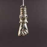 A CLENCHED FIST PENDANT. 6cms long.