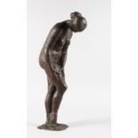 ATTRIBUTED ANDERS ZORN (1860-1920) SWEDISH A bronze standing nude, both hands on her leg.