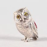 A SMALL SILVER NOVELTY OWL PIN CUSHION.