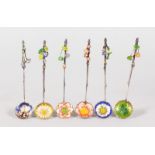 A SET OF SIX SILVER AND ENAMEL SPOONS.
