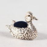 A SMALL SILVER NOVELTY DUCK PIN CUSHION.