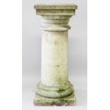A PLAIN CIRCULAR PEDESTAL with square top and base. 3ft 8ins high, 1ft 5ins wide.