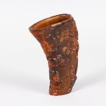 A LARGE CARVED HORN LIBATION CUP. 8ins long.