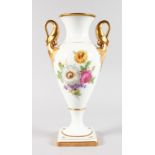 A TALL CONTINENTAL WHITE PORCELAIN TWO HANDLED URN SHAPED VASE with gilt swan handles. 35cms high.