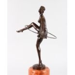 AFTER ALONSO AN ART DECO STYLE BRONZE FIGURE OF THE HOOP DANCER, on a circular marble base. 1ft 7ins