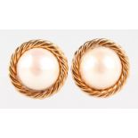 A PAIR OF YELLOW GOLD AND PEARL EAR CLIPS.