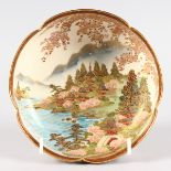 A JAPANESE SATSUMA CIRCULAR SHAPED BOWL with landscape pattern. 6ins diameter.