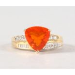 AN UNUSUAL 14CT YELLOW GOLD TRILLION CUT FIRE OPAL RING with diamond shoulders.