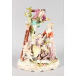 A GOOD LARGE DRESDEN STYLE PORCELAIN GROUP, a gallant up a tree picking apples, with cupids and