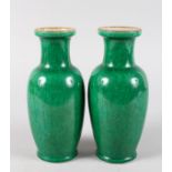 A SMALL PAIR OF CHINESE GREEN CRACKLE GLAZE VASES. 8ins high.