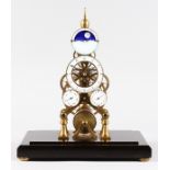 A GOOD MOONFACE BRASS SKELETON CLOCK with fusee movement, in a glass case. 1ft 5ins high.