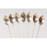 A SET OF SIX TIFFANY & CO STERLING SILVER LONG HANDLED SPOONS with leaf bowls.