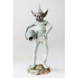 A BRONZED COPPER MODEL OF A PIXIE, laughing and holding a vase. 4ft 2ins high.