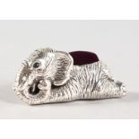 A SILVER LYING ELEPHANT PIN CUSHION.