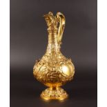 A SUPERB VICTORIAN IRISH SILVER GILT CLARET JUG, repousse with flowers, with angels lion head.