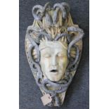 A MEDUSA HEAD WALL FOUNTAIN. 1ft 10ins high.