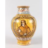 AN ITALIAN POTTERY VASE with a portrait of a saint. 12ins high.