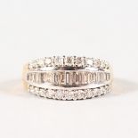 A SUPERB 18CT WHITE GOLD TRIPLE ROW DIAMOND RING.