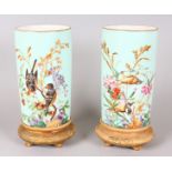 A PAIR OF VICTORIAN CONTINENTAL PORCELAIN SPILL VASES, painted with brilliant coloured birds and
