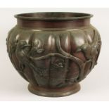 A 19TH CENTURY JAPANESE BRONZE JARDINIERE, the sides with almond blossom and birds in relief.
