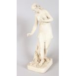 A VICTORIAN PARIAN FIGURE OF A YOUNG CLASSICAL LADY standing beside a trunk with lilies of the