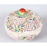 A CONTINENTAL PORCELAIN PIERCED CIRCULAR POTPOURRI BOWL AND COVER with strawberry finial. 7ins