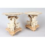 A PAIR OF COPELAND PORCELAIN CIRCULAR COMPORTS with three classical females, supported on a