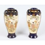 A PAIR OF JAPANESE BLUE AND GILT VASES, with two panels of young ladies. 8.5ins high.