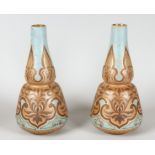 A PAIR OF ART DECO DOULTON SILICON BULBOUS VASES. 10.5ins high.