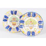 A PAIR OF COLOURFUL DELFT PLATES. 9ins diameter.