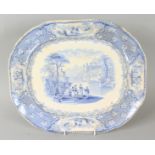 A STAFFORDSHIRE BLUE AND WHITE MEAT DISH, figures in a palladium setting. 15ins wide.