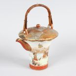 AN UNUSUAL SHAPED JAPANESE SATSUMA TEAPOT AND COVER with wicker handle. 5.5ins high.