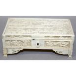 A CHINESE CANTON IVORY RECTANGULAR BOX, circa 1900, with hinged cover, the cover and sides carved