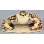 A GOOD JAPANESE EDO/MEIJI PERIOD IVORY NETSUKE, carved in the form of two shi-shi supporting a