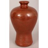 AN UNUSUAL CHINESE IRON RUST CRACKLEGLAZE MEIPING PORCELAIN VASE, applied with an underlying