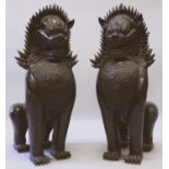 A VERY LARGE PAIR OF SOUTH-EAST ASIAN BRONZE MODELS OF TEMPLE LION GUARDIANS, each seated on its