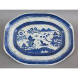 A 19TH CENTURY CHINESE CANTON BLUE & WHITE PORCELAIN DISH, painted to its centre with a river