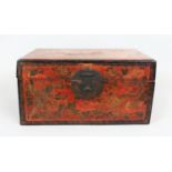 AN 18TH/19TH CENTURY CHINESE RED GROUND LACQUERED WOOD RECTANGULAR CHEST, decorated to the front