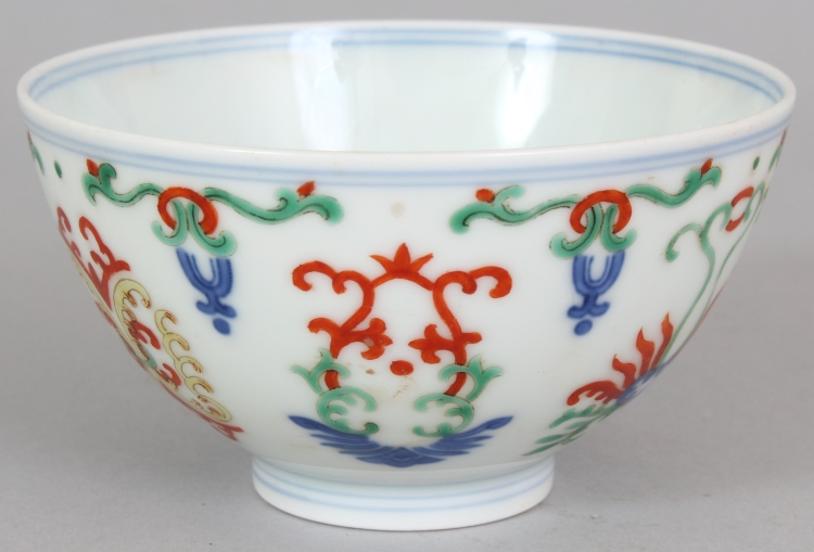 A GOOD QUALITY CHINESE DOUCAI PORCELAIN BOWL, decorated with a variety of formal motifs, the base