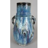 A CHINESE FLAMBE GLAZED PORCELAIN VASE, applied with blue, white, purple and black streaked