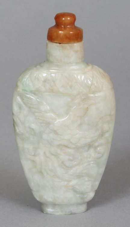 A 20TH CENTURY CHINESE JADE SNUFF BOTTLE, of pale celadon tone, carved to one side with a junk and