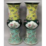 A GOOD LARGE PAIR OF 19TH CENTURY CHINESE FAMILLE ROSE-VERTE PORCELAIN GU VASES, each painted with