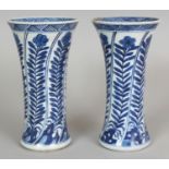 A PAIR OF CHINESE BLUE & WHITE PORCELAIN BEAKER VASES, each decorated with repeated panels of an