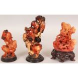 THREE EARLY 20TH CENTURY CHINESE SOAPSTONE CARVINGS, the tallest 7in high overall.